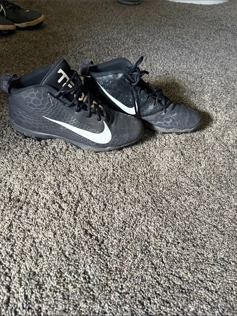 Nike Black Cleats with White Swoosh